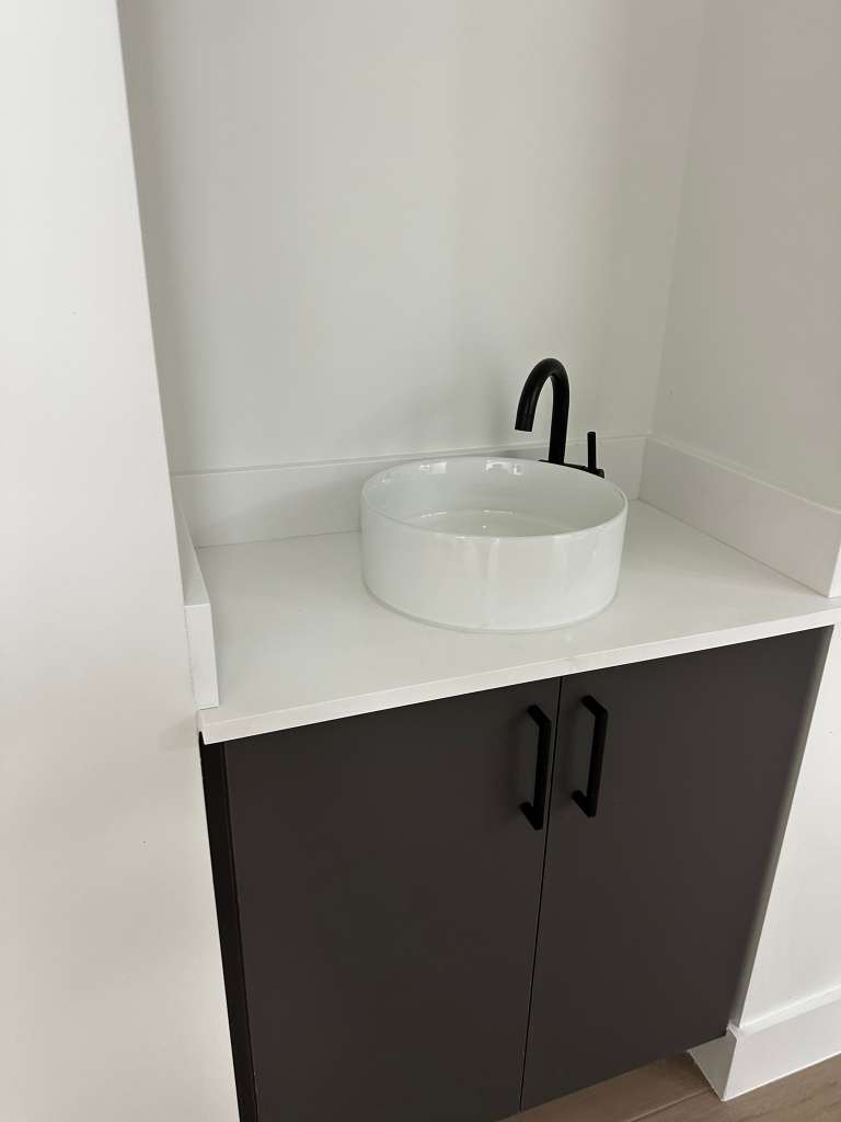 Spotless bathroom vanity and sink after a deep cleaning service