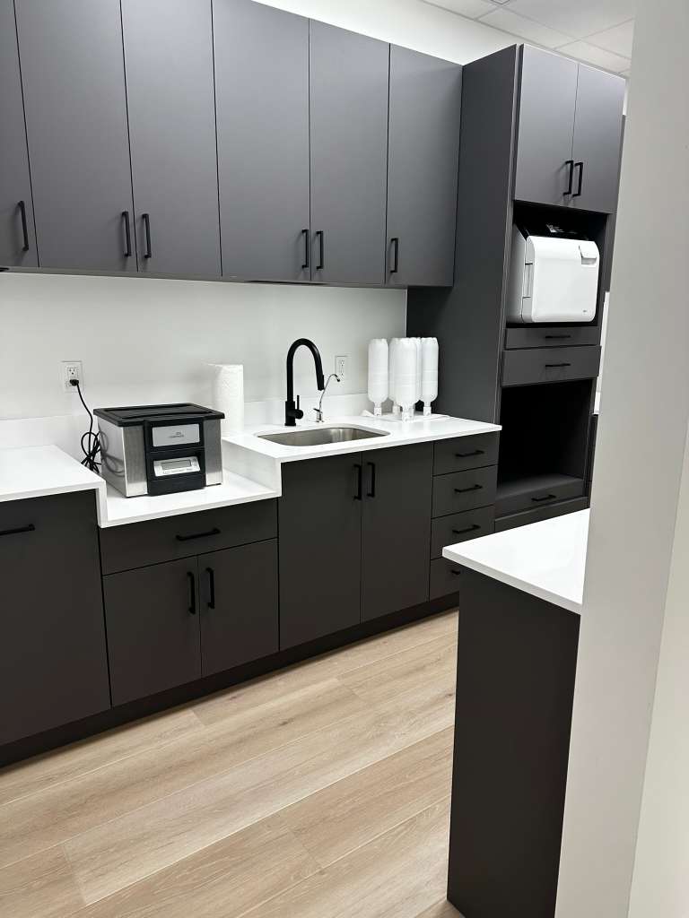 Clean office break room and kitchenette maintained by our commercial cleaning team